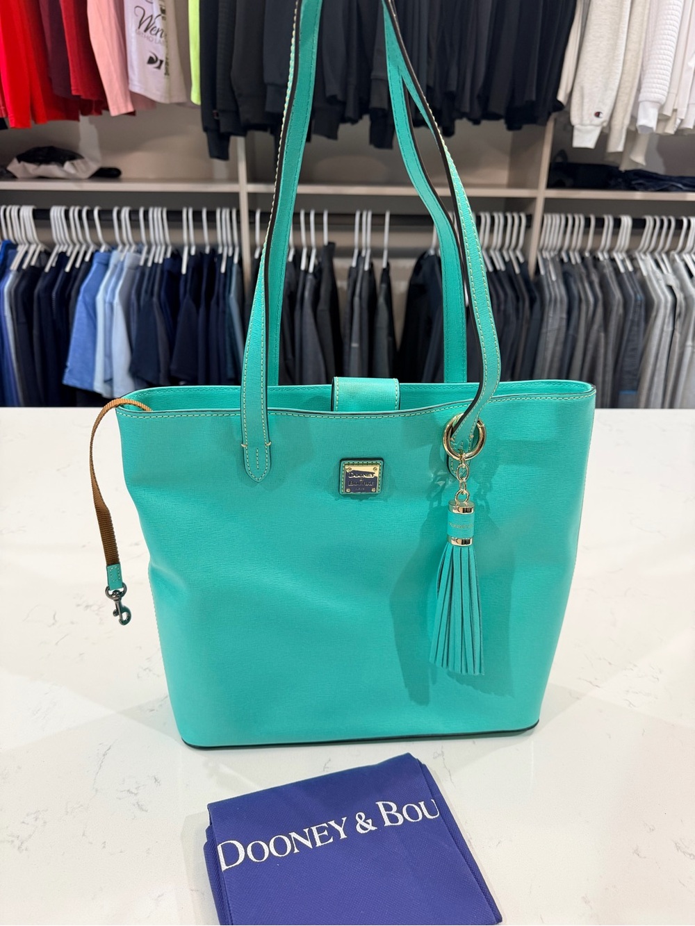 Dooney & Bourke Turquoise Tote with Tassel Charm